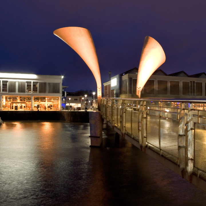 The Millennium Bridge in Bristol in the evening with a light display