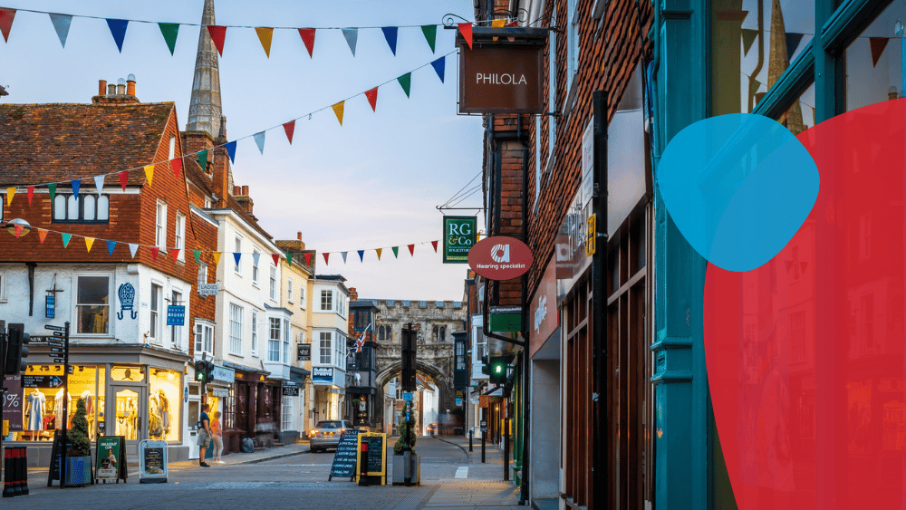 Street in Salisbury with a range of shops and bunting decorations