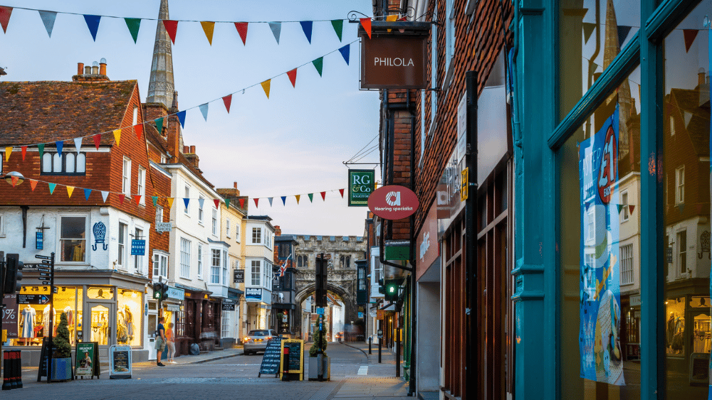 Street in Salisbury with a range of shops and bunting decorations