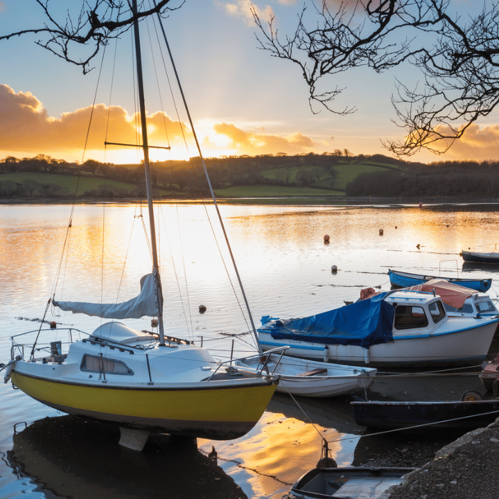 Small boats at sunset anchored in Truro