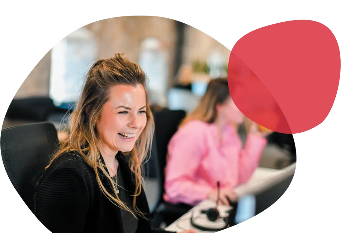 A woman in an office smiling