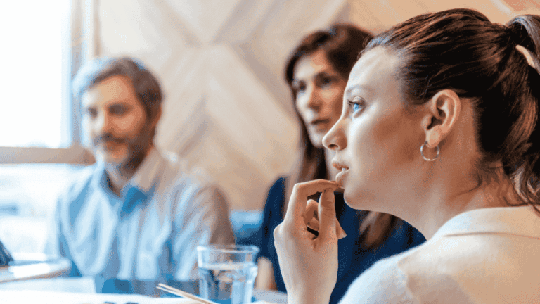 Treasurer and trustees listen during a meering