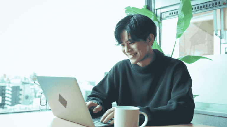 young person working on a laptop preparing their job application
